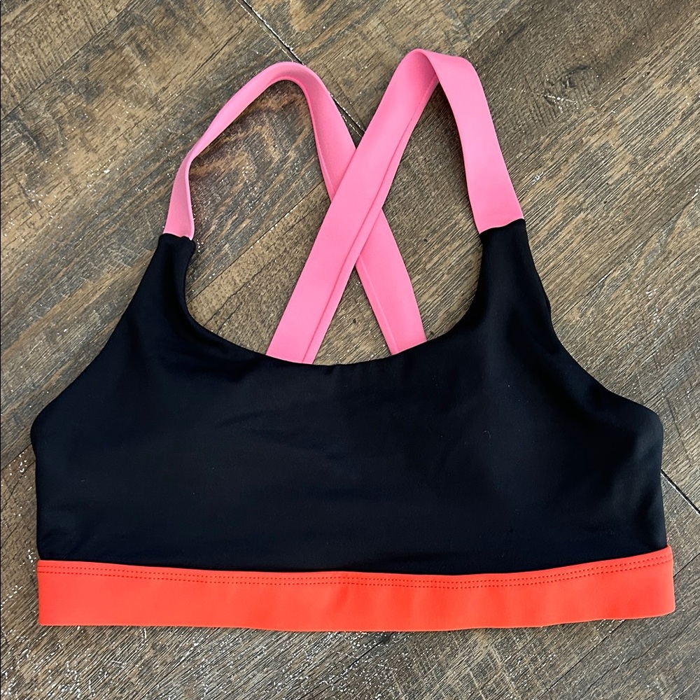Wilo the Label sports bra featuring a vibrant black and coral Size Large